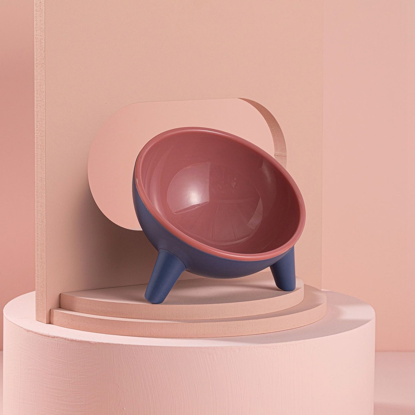 Tilted bowl showing arc inner design with food centered and 8.45oz capacity text