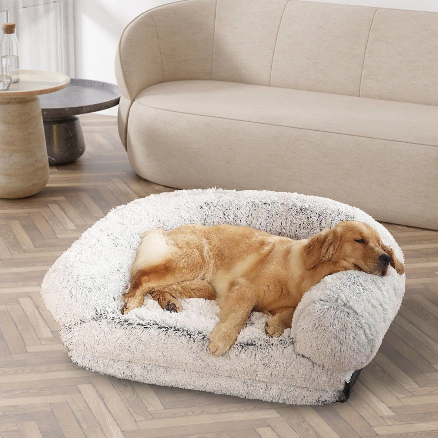 Assembled grey plush bed used as sofa with golden retriever sleeping inside raised rim