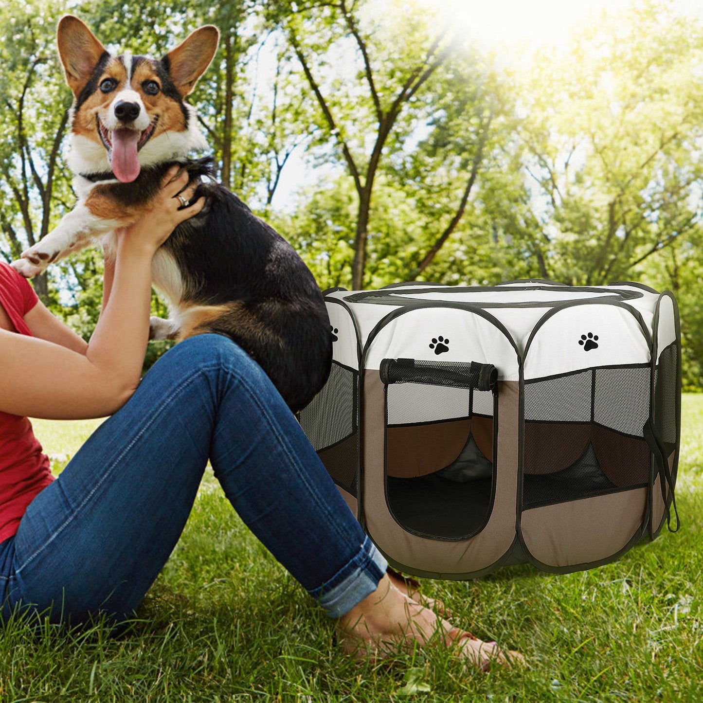 Brown playpen on grass in park next to person and dog, highlighting outdoor portability