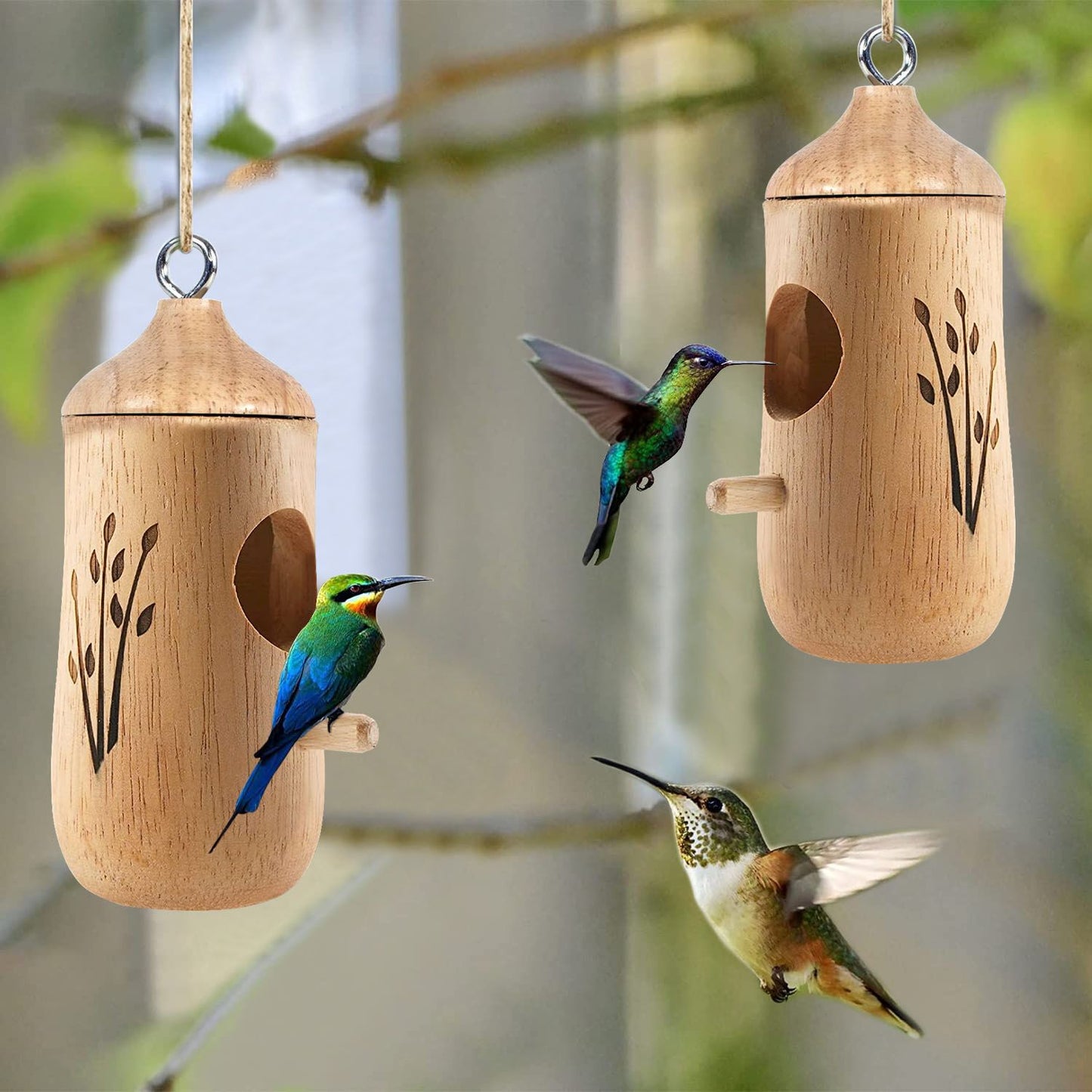 Two wooden hummingbird houses hanging outdoors with hummingbirds flying nearby