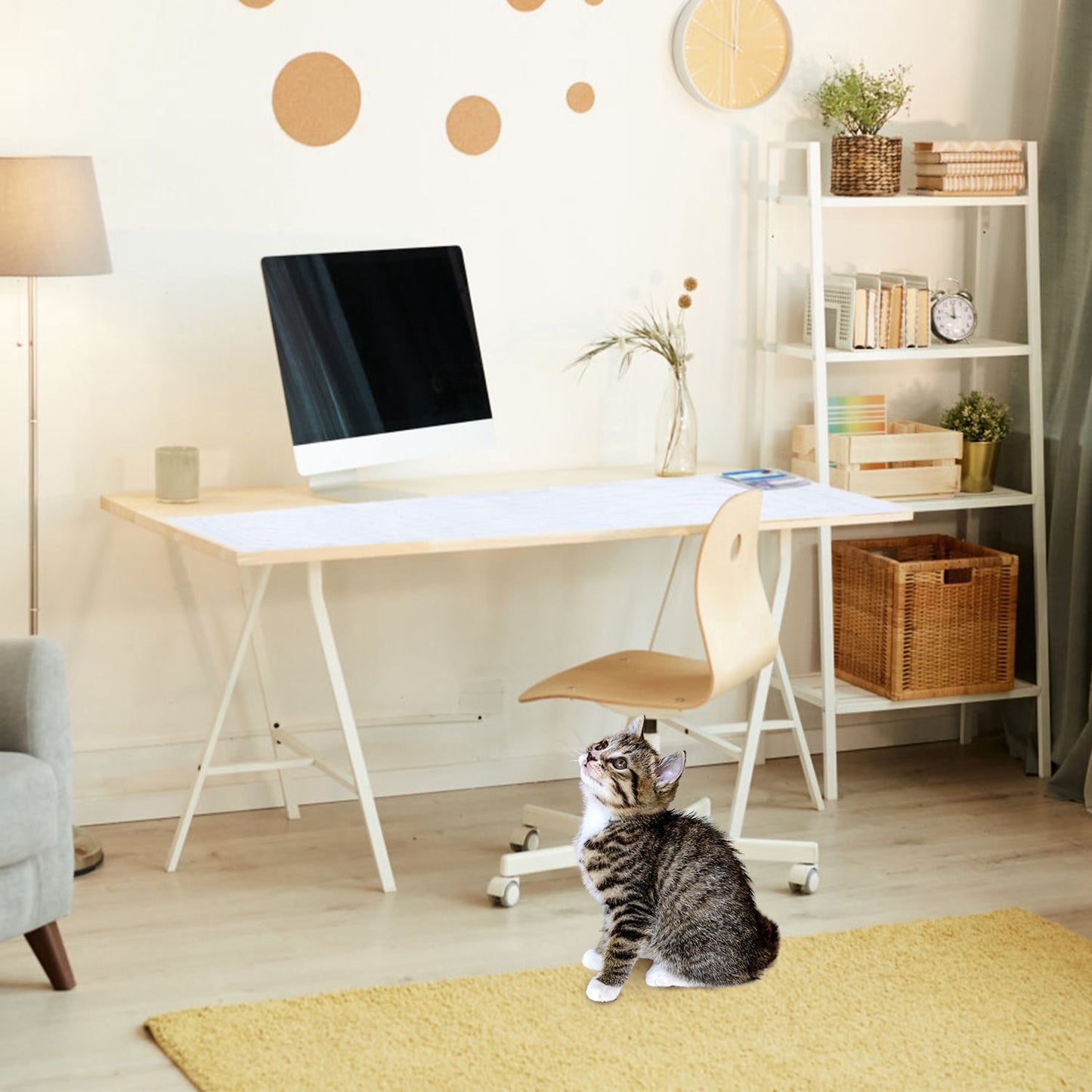 Pet training mat placed on a desk to protect surfaces while a cat sits on the floor