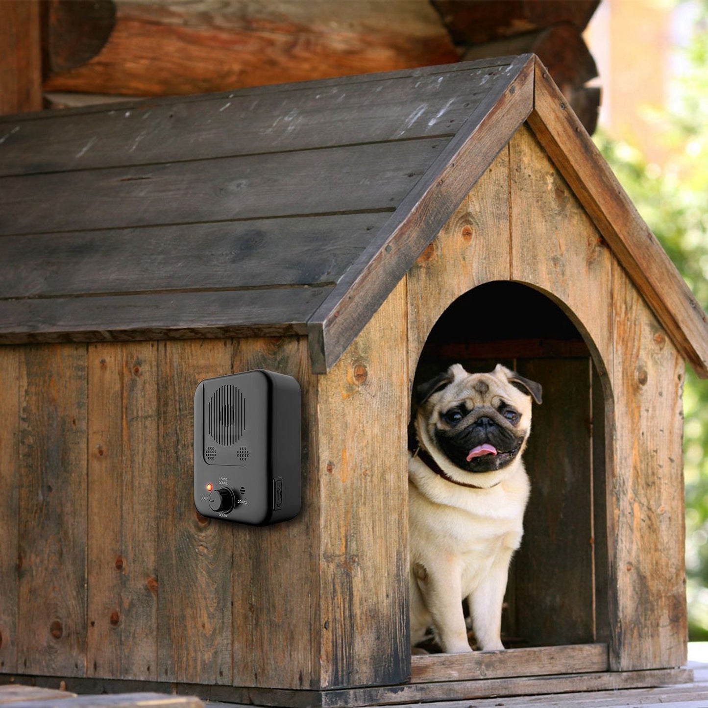 Device mounted on wooden dog house exterior with dog inside, demonstrating outdoor and dog house use