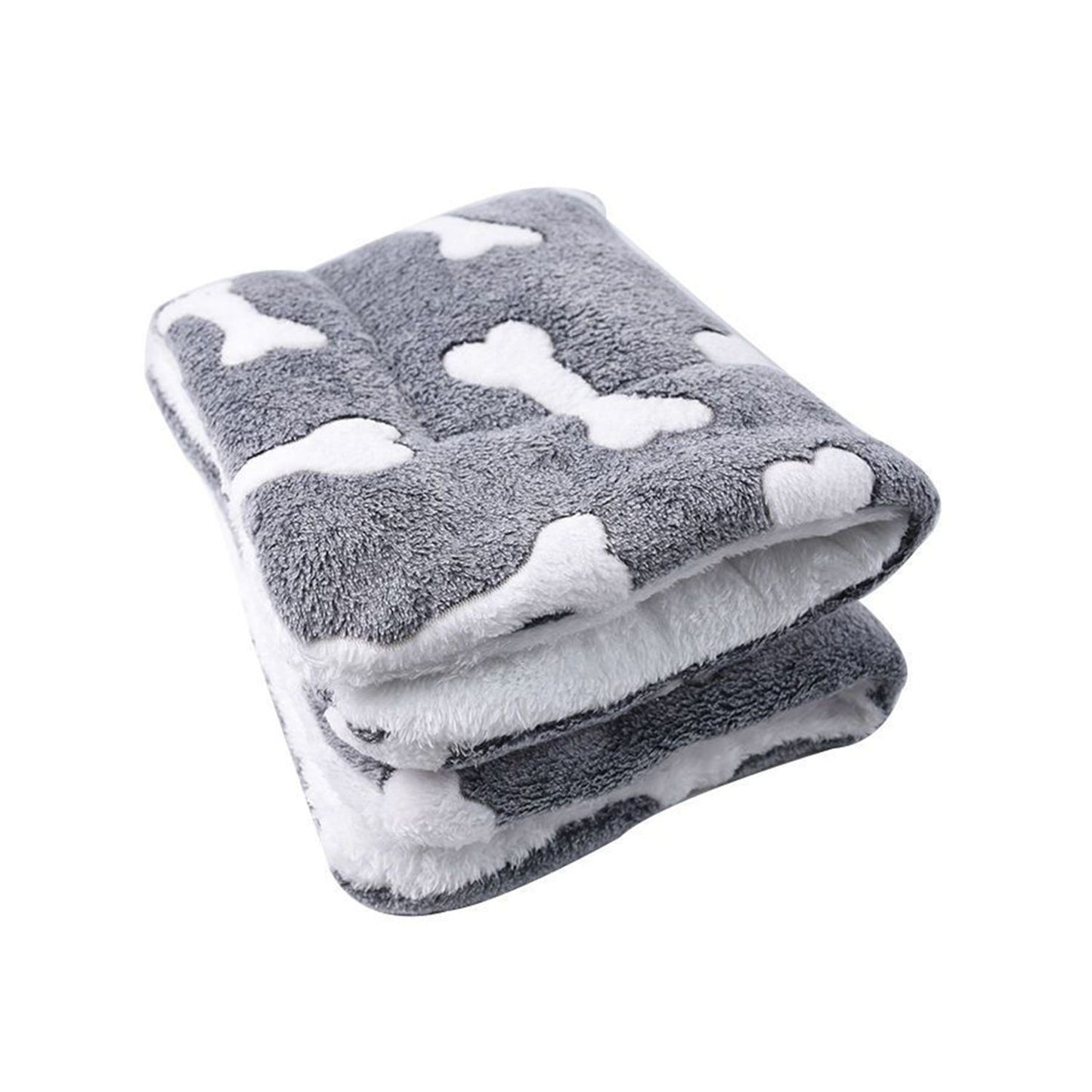 Folded grey bone-pattern dog mat stacked to show compact, portable storage