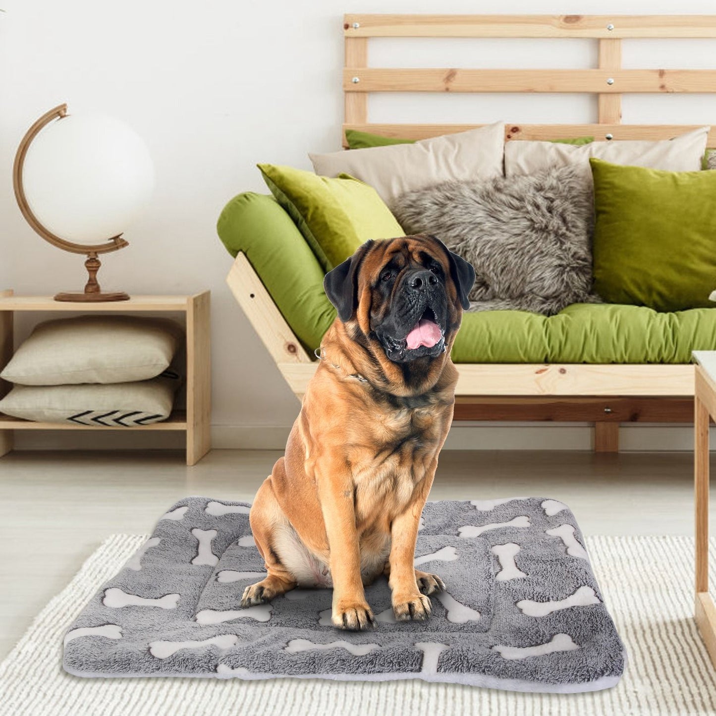 Large dog sitting on grey bone-pattern mat in living room to show support for bigger breeds
