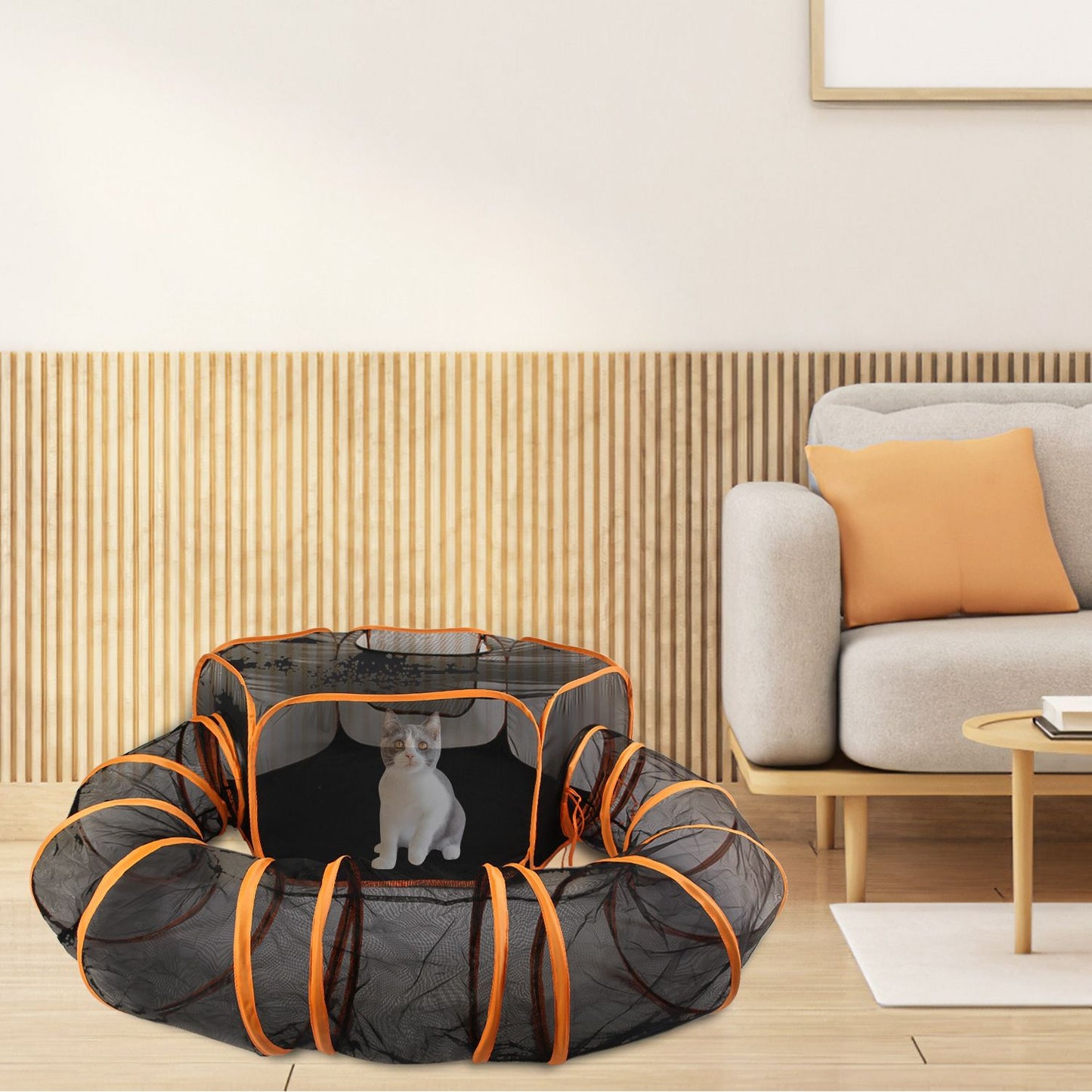 Foldable pet play tent positioned in a modern living room with a cat sitting inside