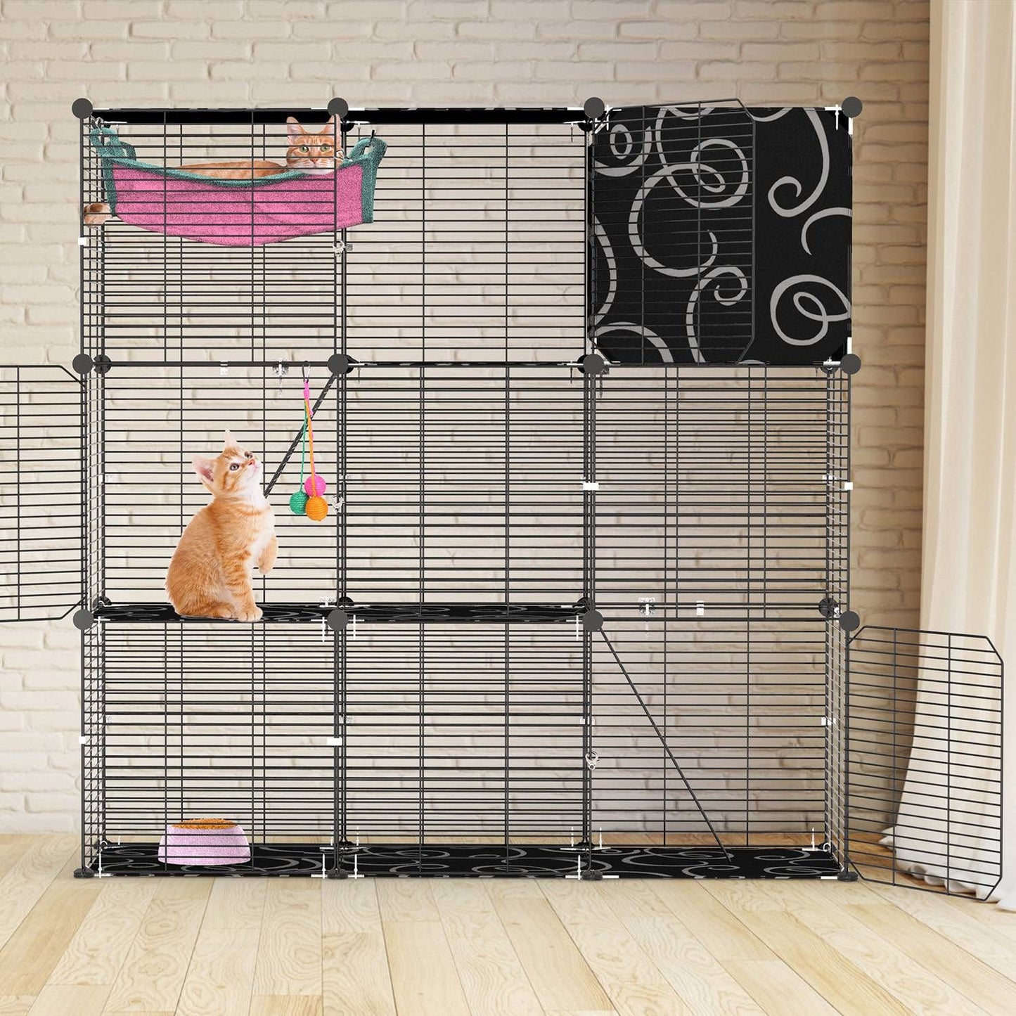 Three-tier cage by a brick wall with side gates open, middle kitten on platform and bottom hide box
