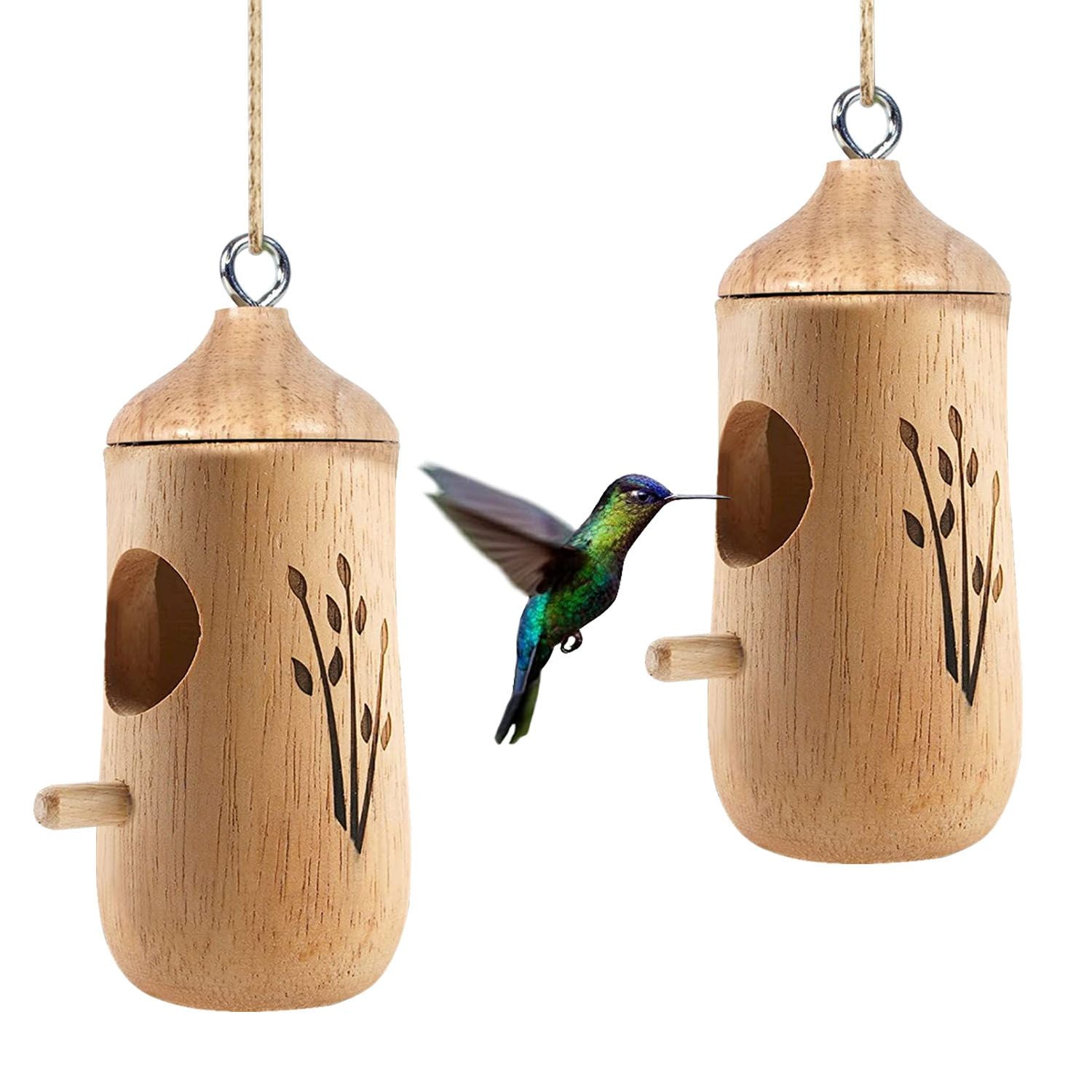 Pair of wooden hummingbird houses with a hovering hummingbird between them on white background
