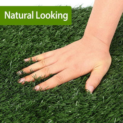 Hand pressing lush artificial grass turf showing realistic soft texture