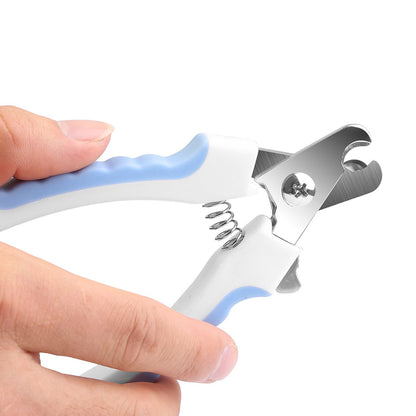 Close-up of stainless steel blade and coil spring mechanism on pet clippers