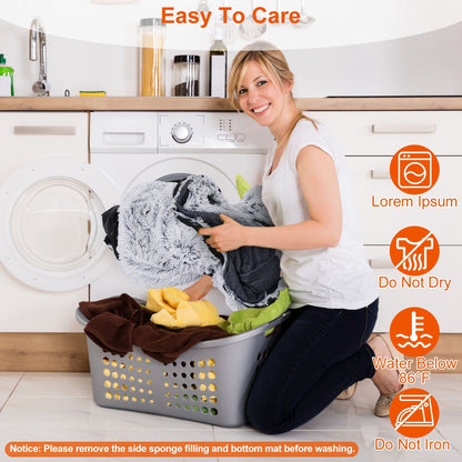 Person loading removable plush cover into washing machine with care icons and washing notice