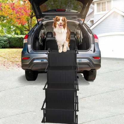 Front view of extended four-step ramp attached to vehicle with dog stepping down