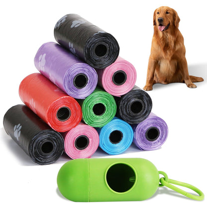 Pyramid of colorful paw-print bag rolls with green dispenser in foreground