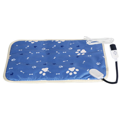 Flat-lay of blue waterproof pet heating pad with paw print pattern and connected controller
