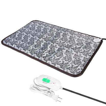 Angled view of floral heated pad with controller and coiled power cord