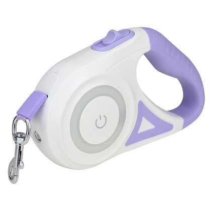 angled view of white and purple retractable leash showing power button and handle grip