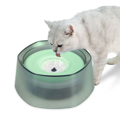 Cat drinking from green-disk spill-proof water bowl with central outlet