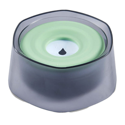 Top view of pet water bowl with pale green floating disk and smoke translucent base