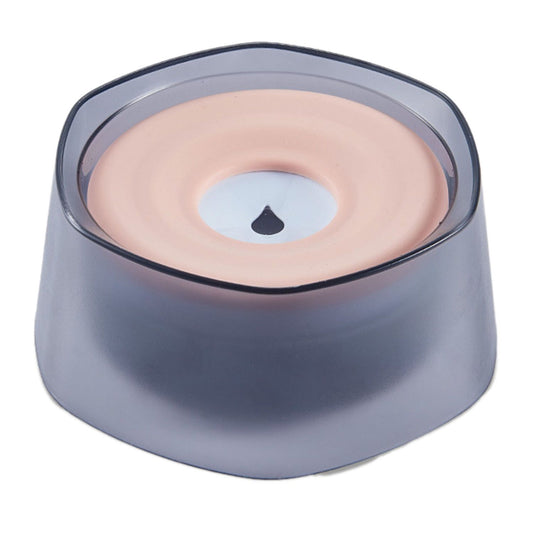 Top view of pet water bowl with pink floating silicone disk and smoky translucent base