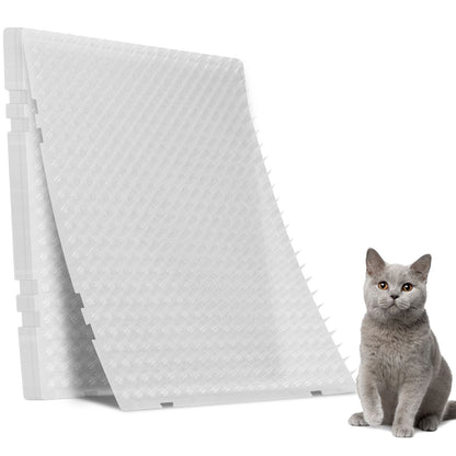 Stacked transparent spiked cat deterrent mats with a grey cat beside them