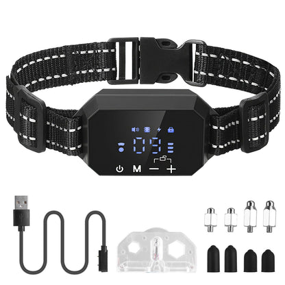 Flat-lay of GPS dog fence collar kit with receiver, magnetic charging cable, test bulb, spare contact points and silicone cap