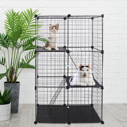 Three-tier black cat cage staged with plants and cats resting on platform perches