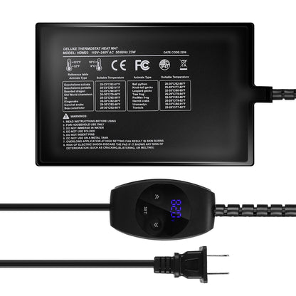 Flat-lay of rectangular heating pad with notched connector, controller with lit display, and long cord