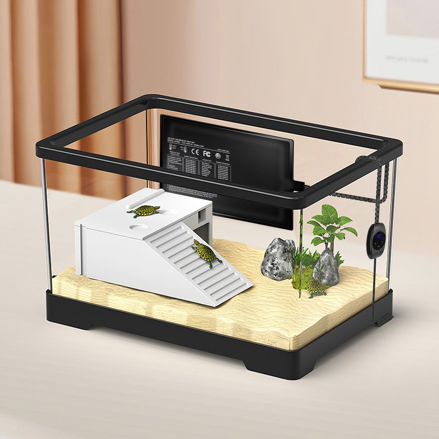 Glass terrarium with substrate and ramp showing rear-mounted heating pad and external controller