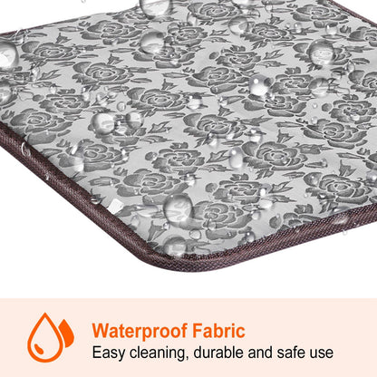 Close-up of waterproof floral fabric on pet heating pad with water droplets beading on surface