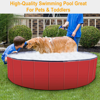 Red portable pet pool in lawn with dog sitting inside showing reinforced side panels