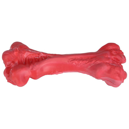 Angled studio image of single red chew bone showing sculpted form and central groove