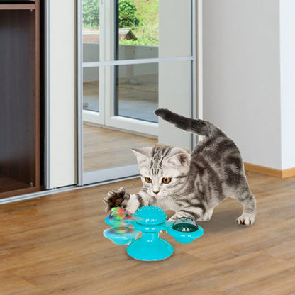 top angled view blue windmill cat toy spiky center and two removable dome bins