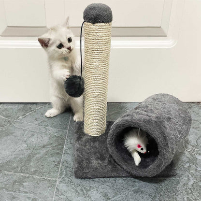 Small kitten batting dangling pom-pom on grey plush scratch post with tunnel mouse