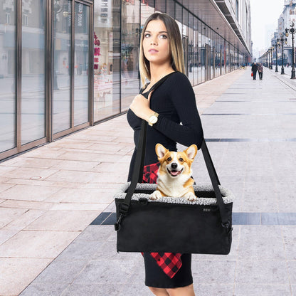 Booster used as a shoulder-carry pet bag with long straps and a small dog inside