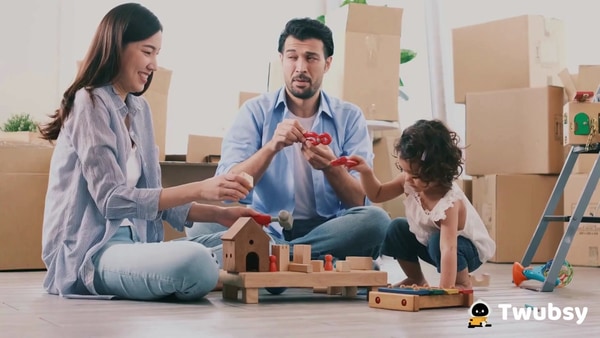 A happy family playing together on the living room floor.