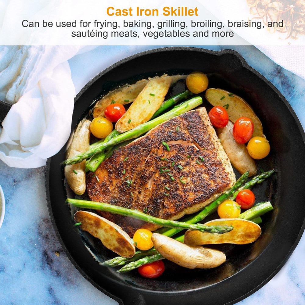Cast iron skillet filled with seasoned fish, asparagus, and colorful cherry tomatoes, ideal for versatile cooking methods like frying, baking, and grilling.