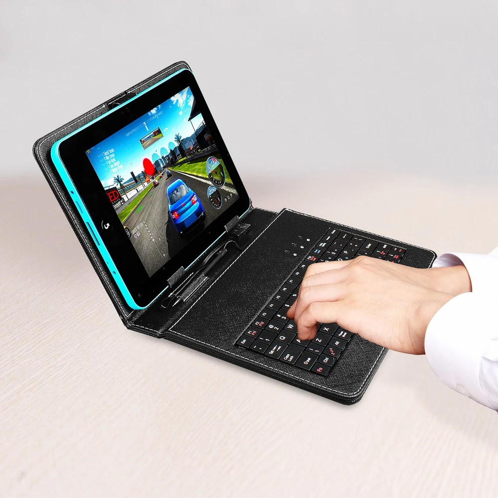 Tablet with detachable keyboard case, displaying a racing game on the screen, and a hand interacting with the keyboard.