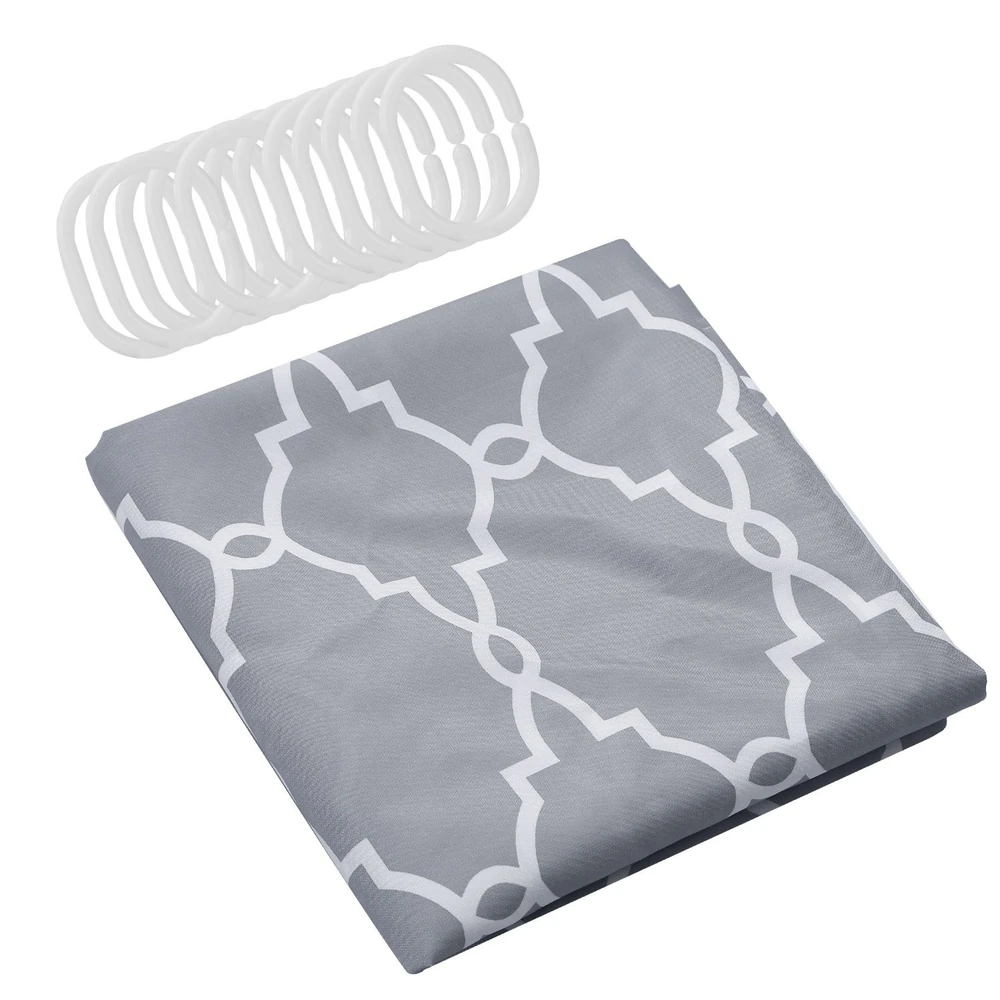 Gray shower curtain with white geometric pattern and matching shower curtain rings.