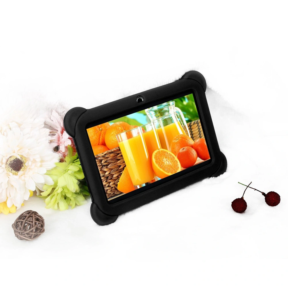 Black-framed tablet displaying a vibrant image of orange juice and fresh oranges, surrounded by colorful flowers and decorative items on a soft white background.
