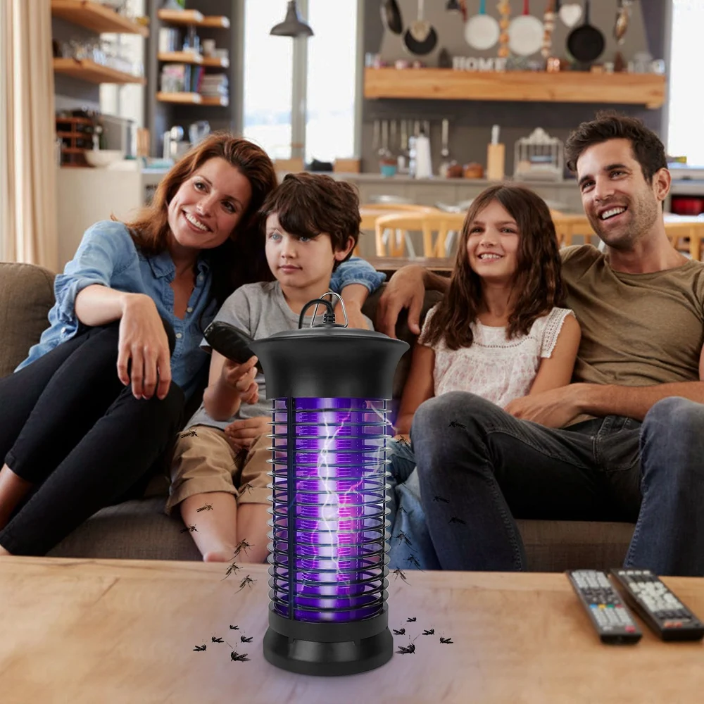 Indoor insect zapper in a cozy living room setting, featuring a family relaxing on the sofa while the zapper emits purple light to attract and eliminate flies and mosquitoes.