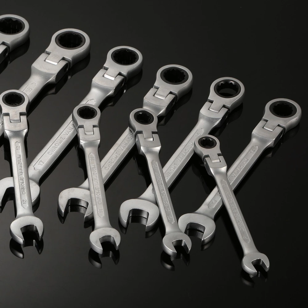 Set of chrome vanadium ratchet wrenches arranged on a black background, showcasing various sizes and designs for automotive and mechanical repairs.