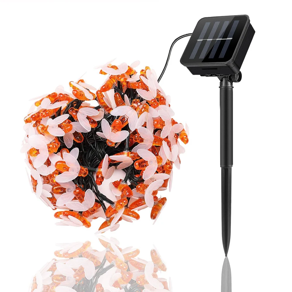 Solar-powered decorative string lights with orange and white butterfly-shaped LED bulbs, ideal for outdoor garden or patio decoration.