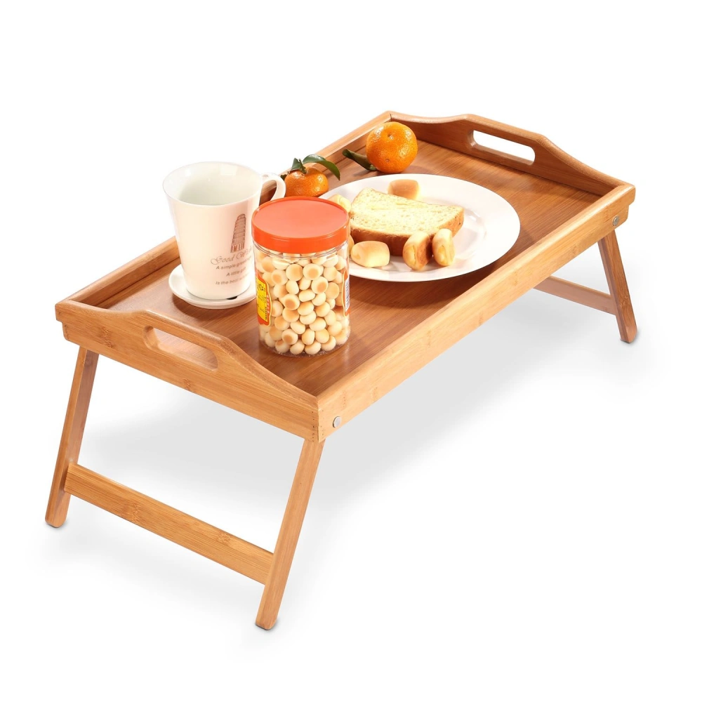 Bamboo breakfast tray with handles, featuring a cup, a jar of snacks, tangerines, slices of bread, and cookies on a clean background.