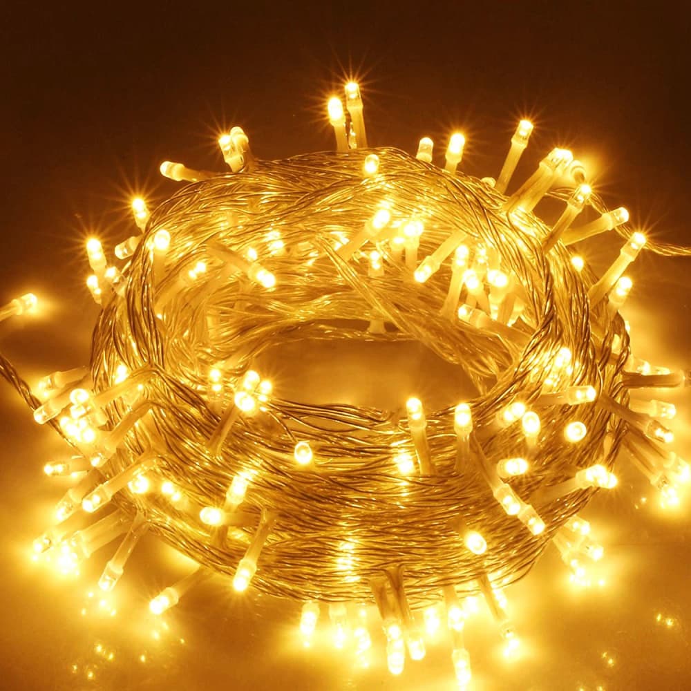 Fairy string lights with warm white LED bulbs on a flexible silver wire, perfect for indoor and outdoor decoration.