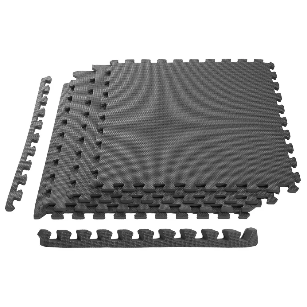Black interlocking foam floor mats stacked with edge pieces, ideal for workout areas, playrooms, and versatile flooring solutions.