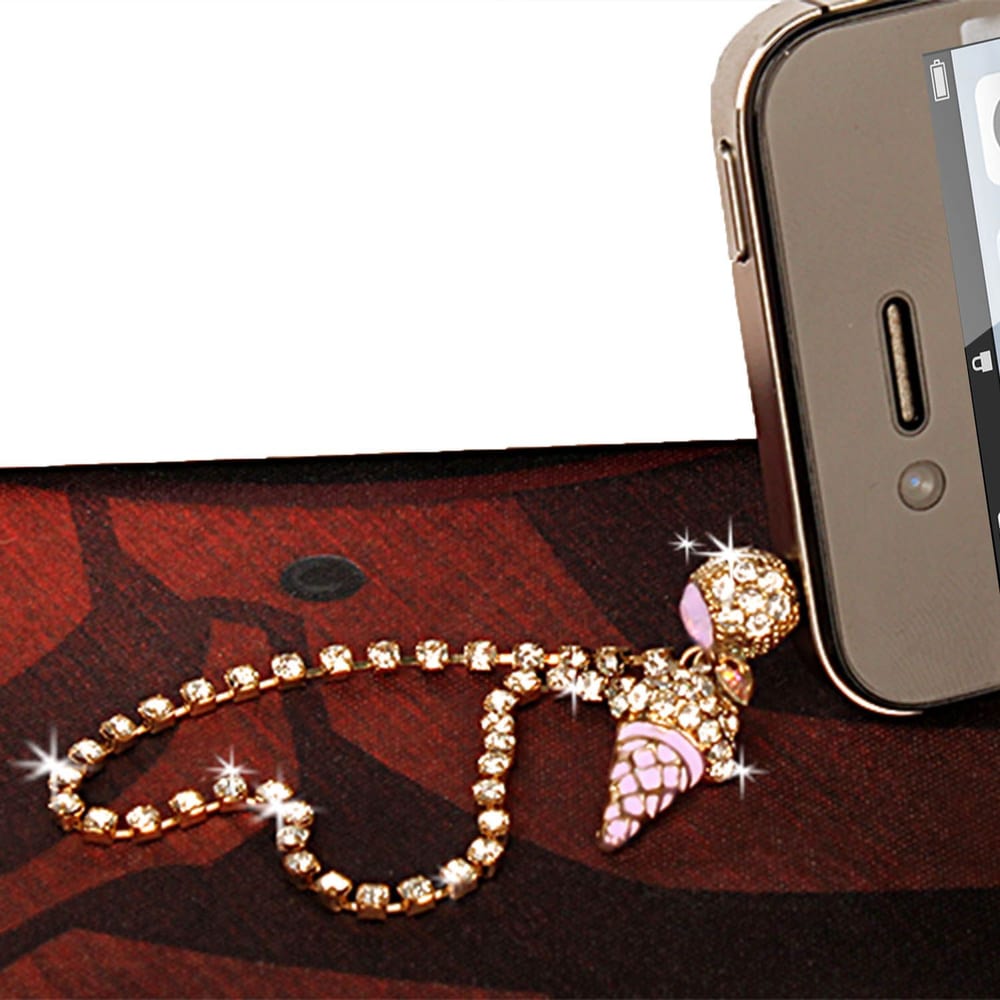 Sparkling ice cream phone charm with rhinestones and a pink cone, elegantly draped over a mobile device on a textured background.