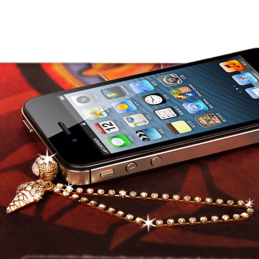 Gold charm phone strap featuring a mini ice cream cone, attached to a smartphone displaying a colorful app interface.