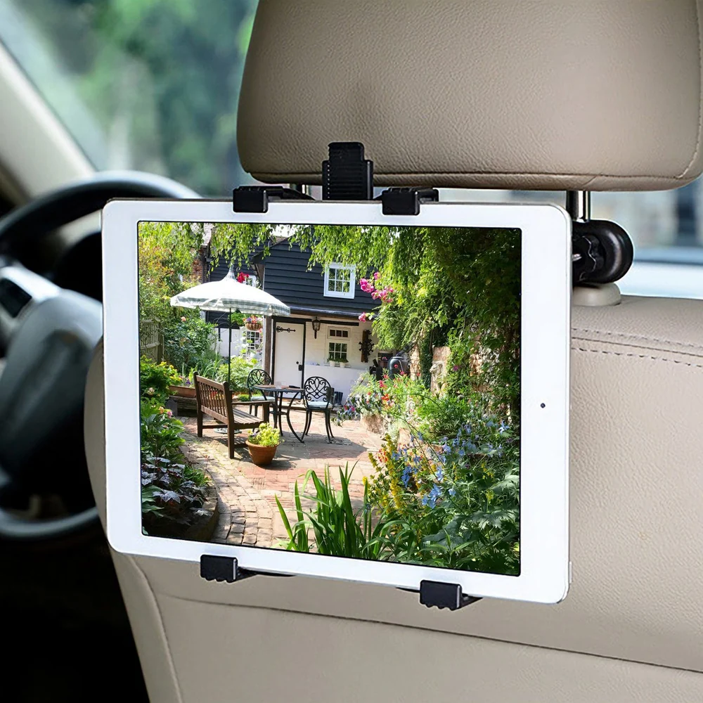 Tablet holder mounted on car headrest displaying a vibrant garden scene, providing entertainment for backseat passengers.