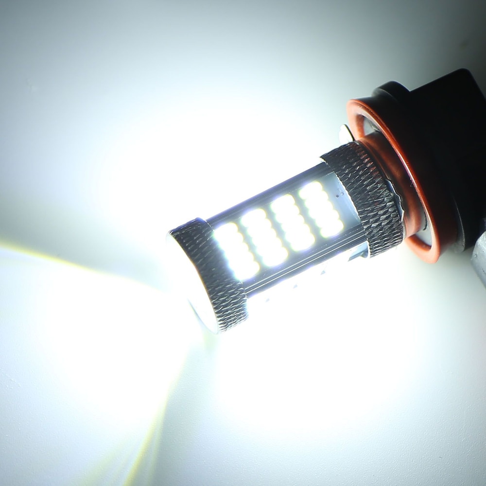 LED car bulb emitting bright white light, featuring a sleek design with a textured aluminum base and rubber seal for secure fitting.