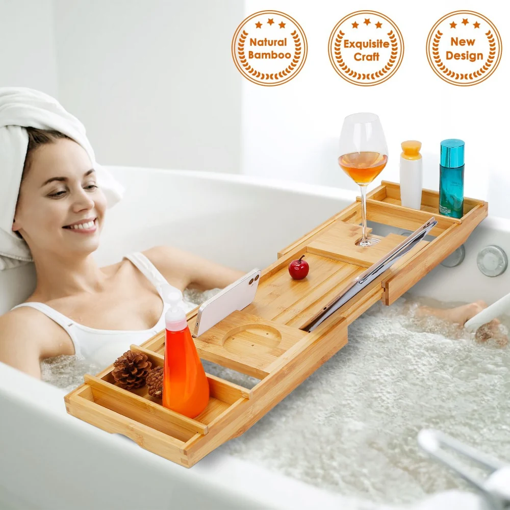 Bamboo bathtub tray table with wine glass, phone holder, and storage compartments for bath essentials, ideal for relaxing spa-like experiences at home.