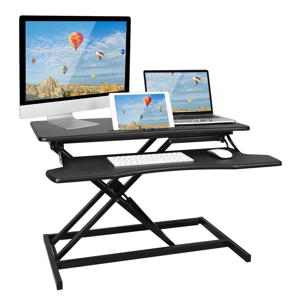 Adjustable standing desk converter with dual monitor setup, laptop, tablet, keyboard, and mouse on a sleek black surface, enhancing ergonomic workspace organization.